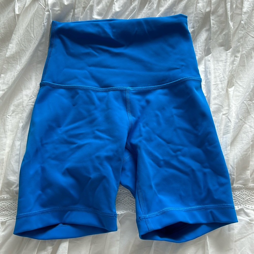 Wonder train 5/4 inch biker shorts, poolside blue, small stain on the front.